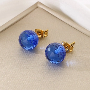 Detailed view of faceted blue crystal stud earrings with gold-plated titanium steel pins
