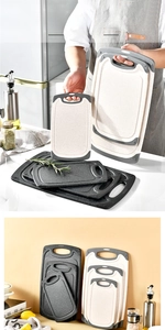 Three-piece non-slip plastic cutting board set with handles in different sizes for home kitchen