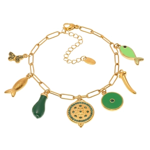 Detail of 18k gold plated stainless steel bracelet with green fish charms and blue zircon