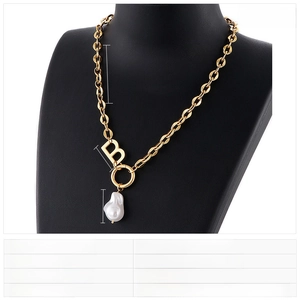 Close-up of gold-tone letter B pendant with baroque pearl on stainless steel chain