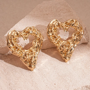 Vintage irregular heart-shaped gold stud earrings with textured molten lava metal design