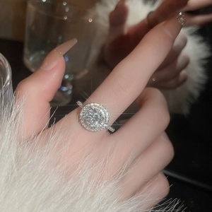 Close-up of sparkling zircon cluster ring with elegant round cut stones in silver finish