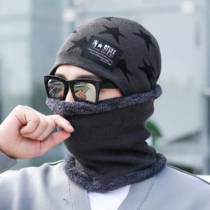 Close-up of grey knitted beanie and neck warmer set with soft fleece lining