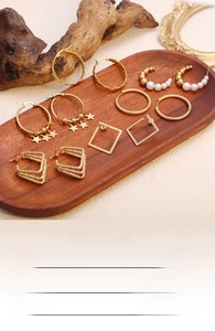 Detail view of 18K gold-plated stainless steel earring set in various geometric designs