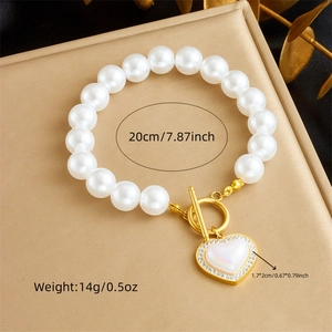 Gold pearl bracelet with heart seashell pendant, rhinestone details and OT clasp buckle