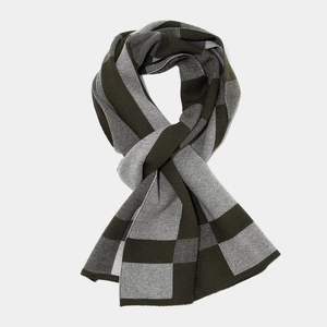 Detail of green and grey checkerboard knit scarf with thick wool blend texture