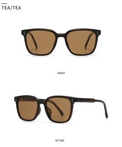 Detail view of round polarized sunglasses with brown lenses and silver metal rivets