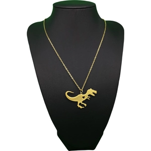 Collana con silhouette di T-Rex dorata e ritaglio a cuore su manichino nero