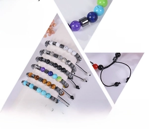 Macro detail of adjustable seven chakra beaded bracelet with natural healing stones