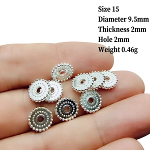 Macro detail of 9.5mm silver plated alloy spacer beads for DIY jewelry making