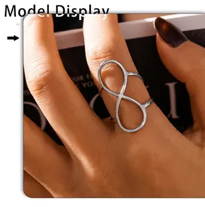 Detailed model shot of a silver minimalist infinity symbol ring with an open design