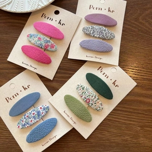 Set of 12 floral fabric BB hair clips for kids in pink purple blue and green tones