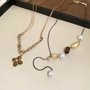 Retro Tiger Eye flower pendant and pearl necklace with a vintage aesthetic for women