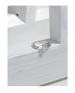 Macro shot of S925 hallmark and inlaid rectangular zircon on a silver open ring