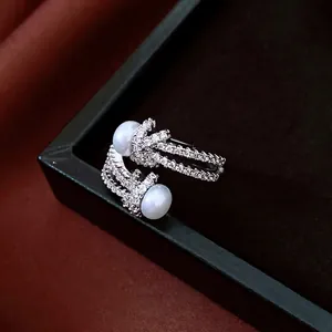 French luxury knot open ring with micro-paved zircons and double white pearls