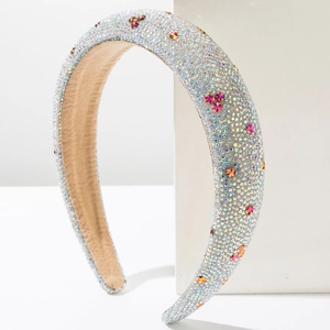 Detail of padded headband with colorful rhinestones and star-shaped crystals on side