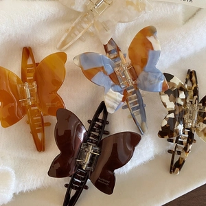 Set of five handmade butterfly acetate hair claws in various elegant patterns and colors