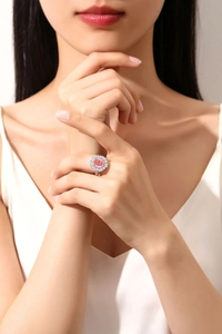 Detailed view of S925 silver ring featuring a round pink gemstone and halo diamonds