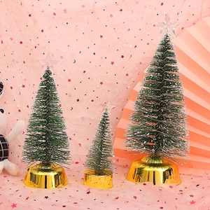 Three-piece set of green Christmas cedar trees with gold bases and transparent star tops
