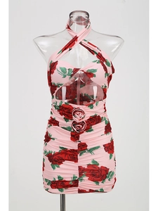 Detailed view of pink floral halter dress with rose print and 3D flower decoration