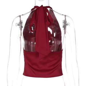 Detail view of the backless tie-up design on this deep red satin halter top