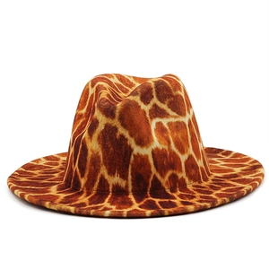 3D giraffe animal print wide brim fedora hat with brown and tan patterns on white background