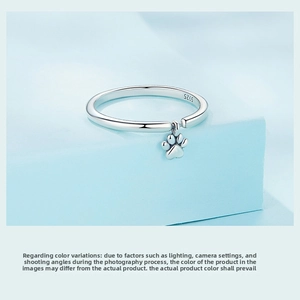 Close-up of S925 sterling silver ring with cute paw charm and engraved hallmark stamp
