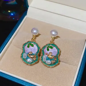 Vintage style silver pin pearl earrings with golden swan enamel pendant in a luxury gift box
