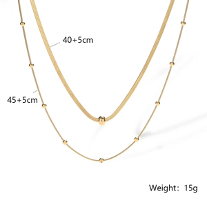 Detailed close-up of double-layered gold titanium necklace with 40+5cm and 45+5cm chain lengths