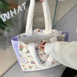 Detail of canvas tote bag with plush handles showing magnetic clasp and interior pocket