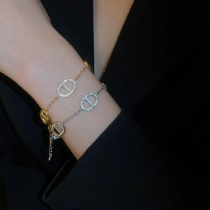 Macro shot of gold and silver pig nose bracelets with sparkling pavé cubic zirconia details