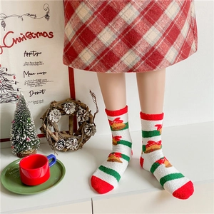 Thick warm Christmas coral fleece socks for women featuring festive bells and red stripes