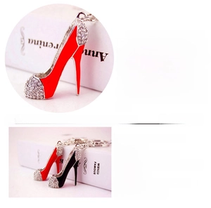 Detail of red and black enamel high heel keychains with sparkling crystal rhinestones