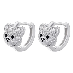 Close-up of teddy bear huggie earrings with white zircon pavé and black stone details