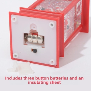 Detailed base view of Christmas lantern showing battery compartment and on-off switch