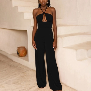 Detailed view of backless black halter jumpsuit with wide legs on a model