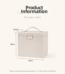 Cream leather jewelry box with gold handle and lock, measuring 22cm x 20cm x 13.5cm