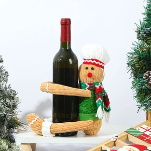 Charming gingerbread man wine bottle holder with knitted chef hat for Christmas decor