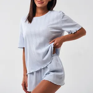 Women's light blue cotton lounge set with ruffle trim and vertical stripe texture