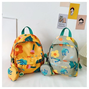 Detail of cute floral kids backpack in yellow and grey with matching round coin purses