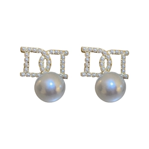 Elegant D-letter pearl drop earrings crafted in gold-toned metal with a minimalist design