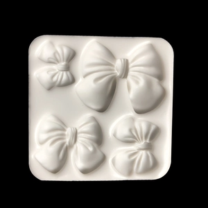 White silicone bow mold with four cavity sizes for DIY fondant and chocolate baking