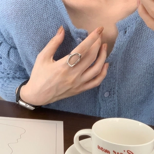 Irregular 925 sterling silver hollow ring shown worn on index finger for daily lifestyle