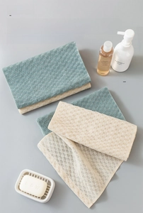 Close-up of woven polyester texture on long exfoliating back scrubber for deep cleaning
