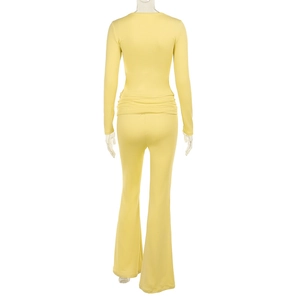 Rear view of light yellow square neck top and flared trousers set on invisible mannequin