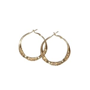 Elegant gold twisted hoop earrings with shimmering pave crystals for a modern luxury look