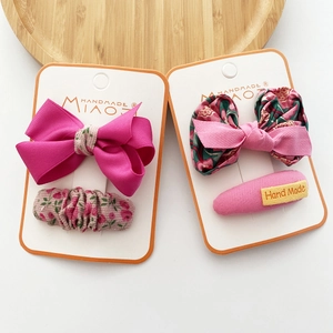 Set of 4 rose red and floral fabric bow hair clips for girls on display cards