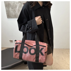 Detailed shot of pink yoga gym bag with black mesh overlay and LOOK graphic print