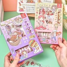 Close-up of food-themed washi tape gift sets in purple and pink held by hands