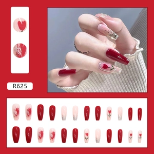 Long ballet press-on nails with red tulip designs, gold glitter, and watercolor art